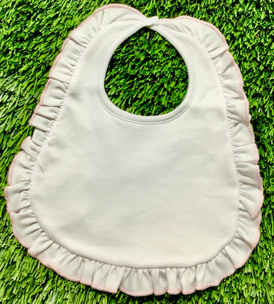 Essentials white bib with pink ruffle